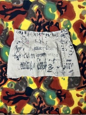 VTG Sag Harbor mini skirt with black graffiti-style text print